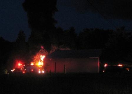 Flames behind the pole barn