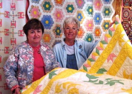 Marcia Graham and Loraine Mottern with the Halfaker/Sparks quilts
