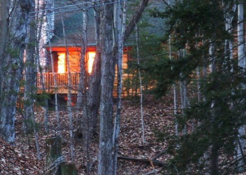 Sunset flames in cabin windows